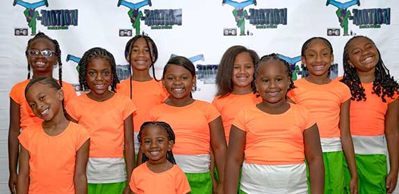 smiling children at a desk
