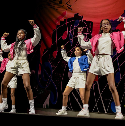 group of kids dancing on stage